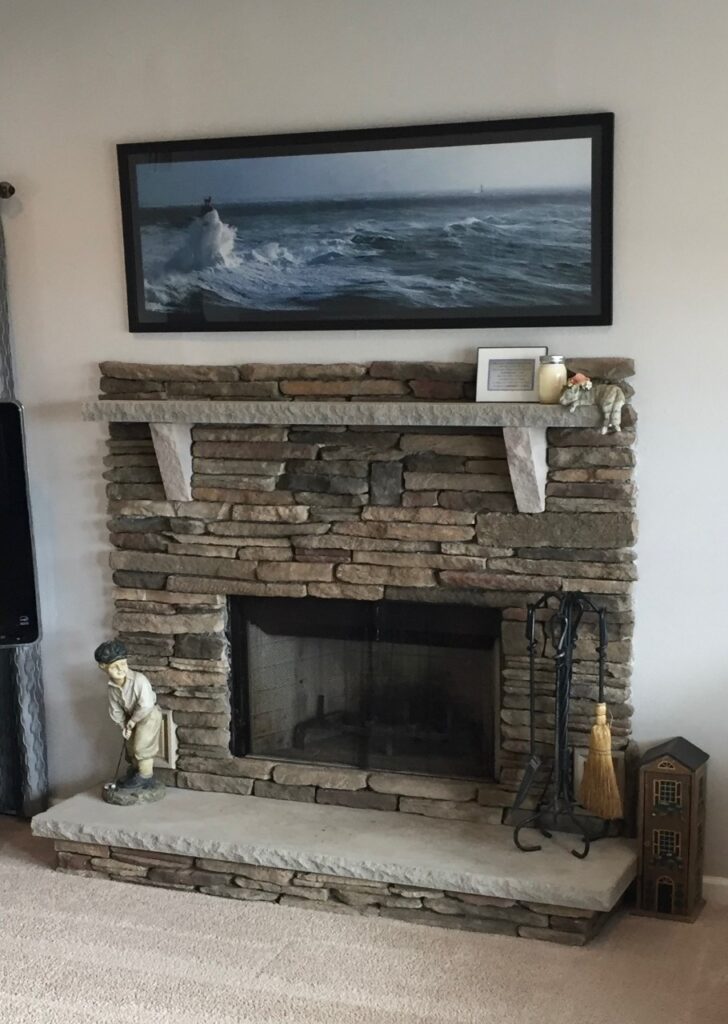 Fireplace remodel with cultured stone by KS Construction & Design